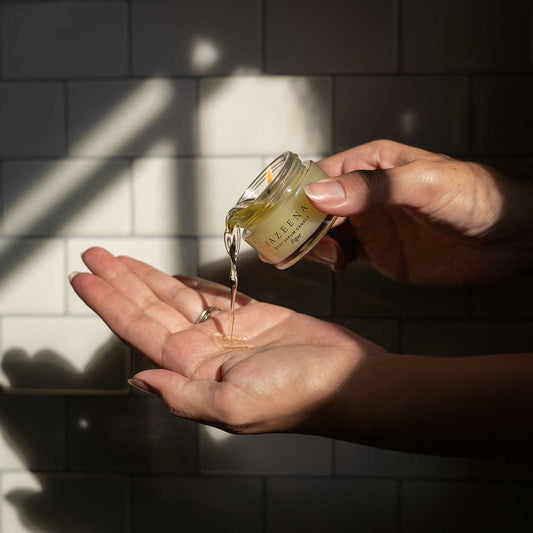 Mini Body Serum Candle being poured on skin